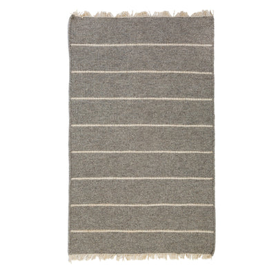 product image of warby handwoven rug in light grey in multiple sizes design by pom pom at home 1 559