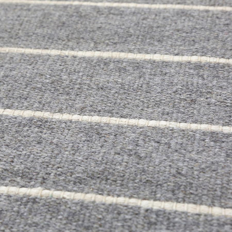 media image for warby handwoven rug in light grey in multiple sizes design by pom pom at home 9 259